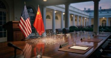 Small US and China flags on a polished wooden table with a glowing digital circuit pattern, set in front of a White House backdrop.
